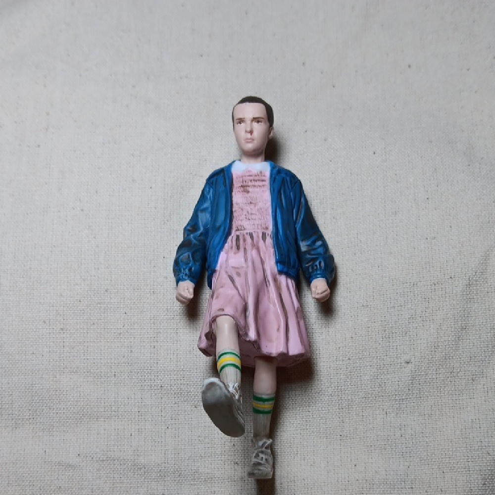 Netflix Action Figure with Blue Jacket and Pink Dress